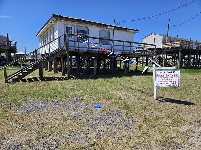 117 Fir Ln. Grand Isle, La. 70358  This is a 2 br/1 Bath camp on large lot with a bay and beach view.